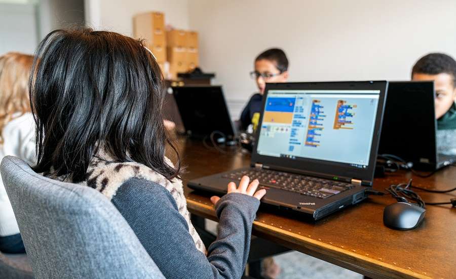 Kids coding in a classroom