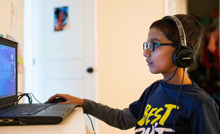A boy having an on-line coding class at home