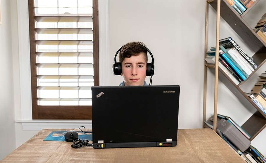 A boy having an online coding class